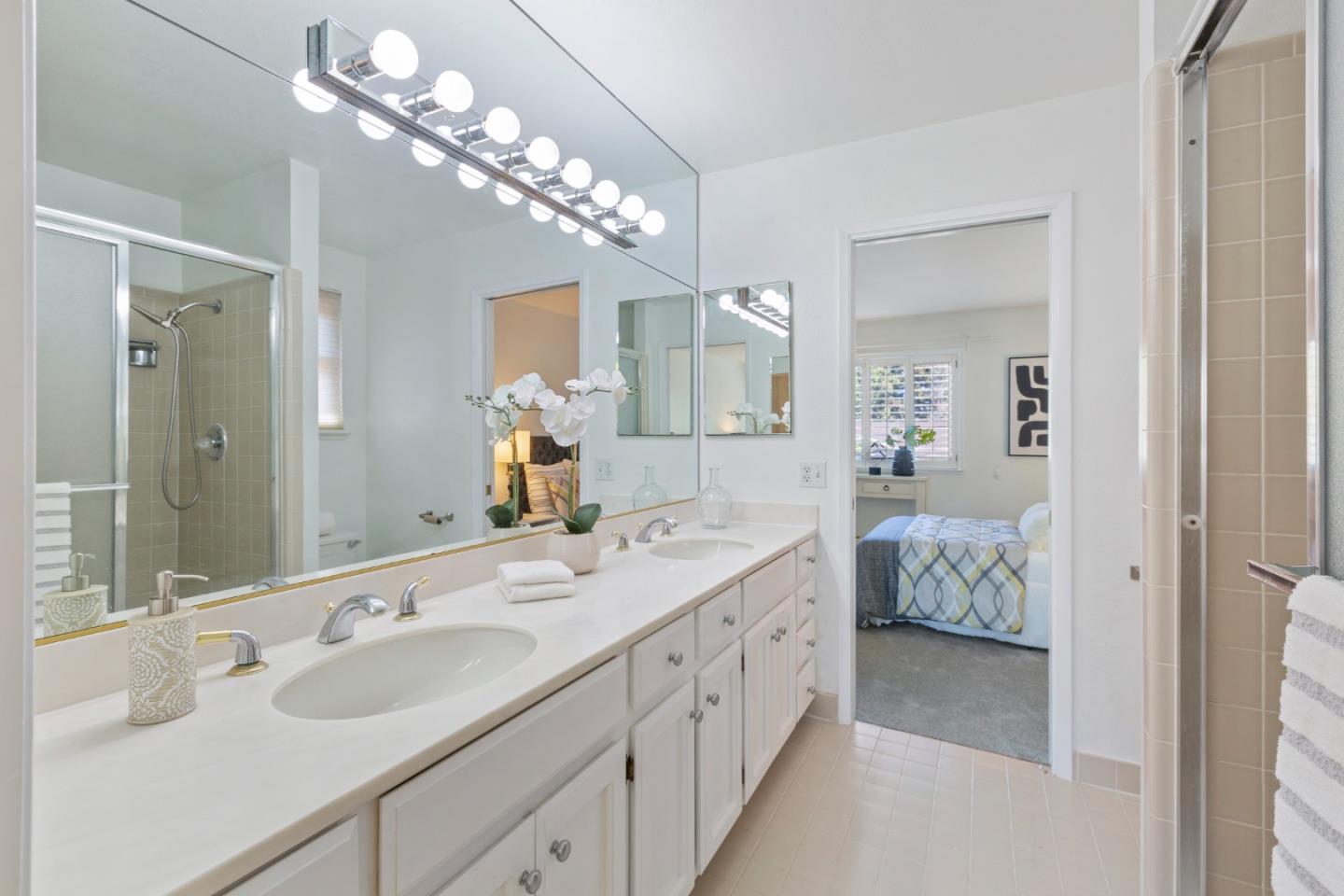 244 Delphi Circle Los Altos, CA 94022 - Photo 35 of 61 a en suite bathroom with double sink and a mirror