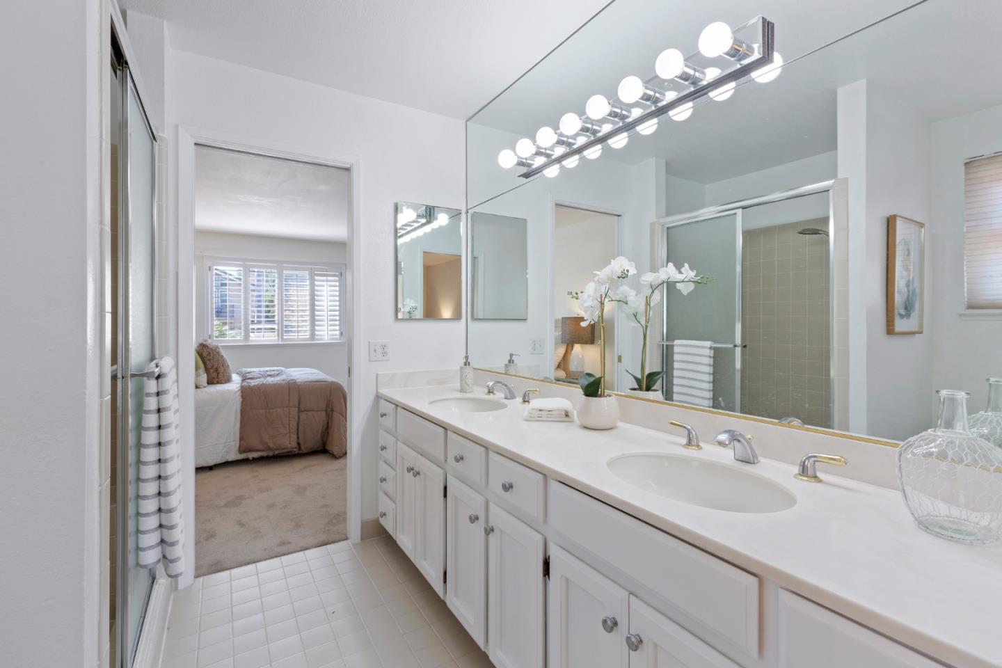 244 Delphi Circle Los Altos, CA 94022 - Photo 36 of 61 a en suite bathroom with a double vanity sink double and mirror