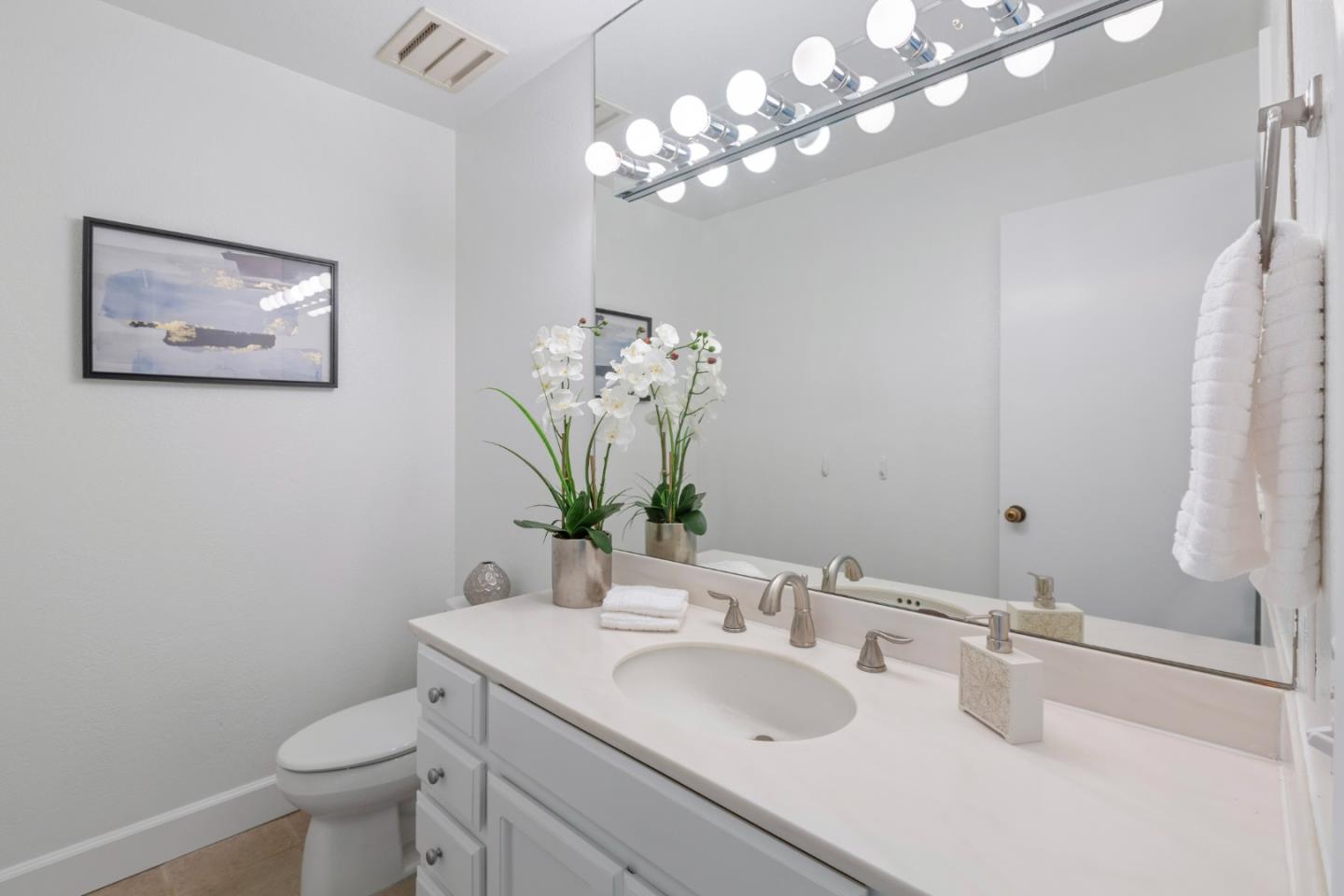 244 Delphi Circle Los Altos, CA 94022 - Photo 40 of 61 a bathroom with a toilet sink and mirror