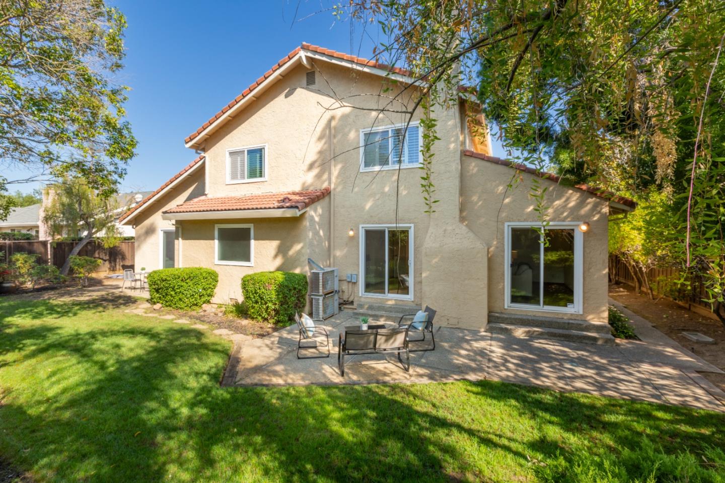 244 Delphi Circle Los Altos, CA 94022 - Photo 42 of 61 a front view of a house with yard and outdoor seating