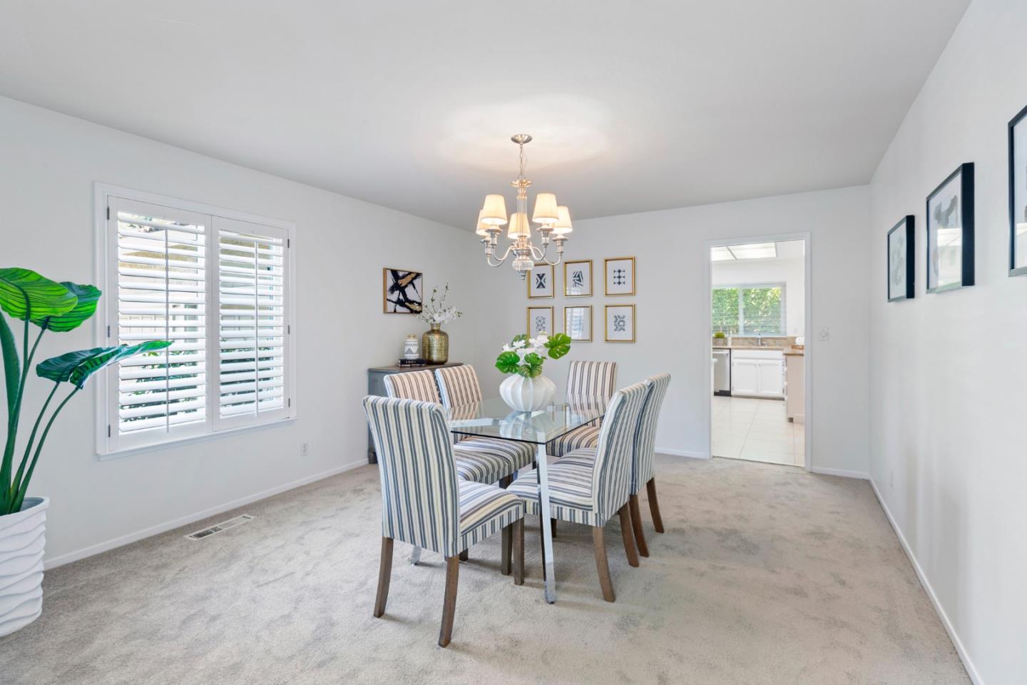 244 Delphi Circle Los Altos, CA 94022 - Photo 10 of 61 a dining room with furniture a chandelier and a window
