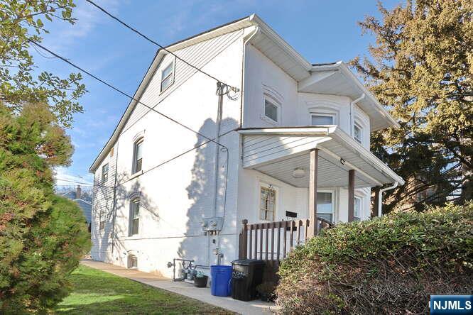68 Mohawk Avenue, Unit 1 Hawthorne, NJ 07506 - Photo 20 of 21 a view of a house with a yard
