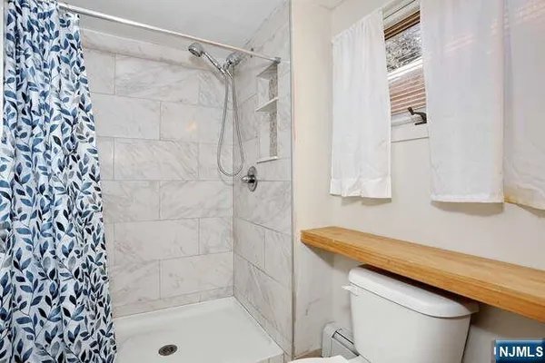 a bathroom with a shower curtain and a sink