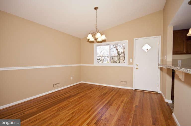 3502 Sedgemoor Road Baltimore, MD 21207 - Photo 8 of 29 wooden floor in an empty room with a window