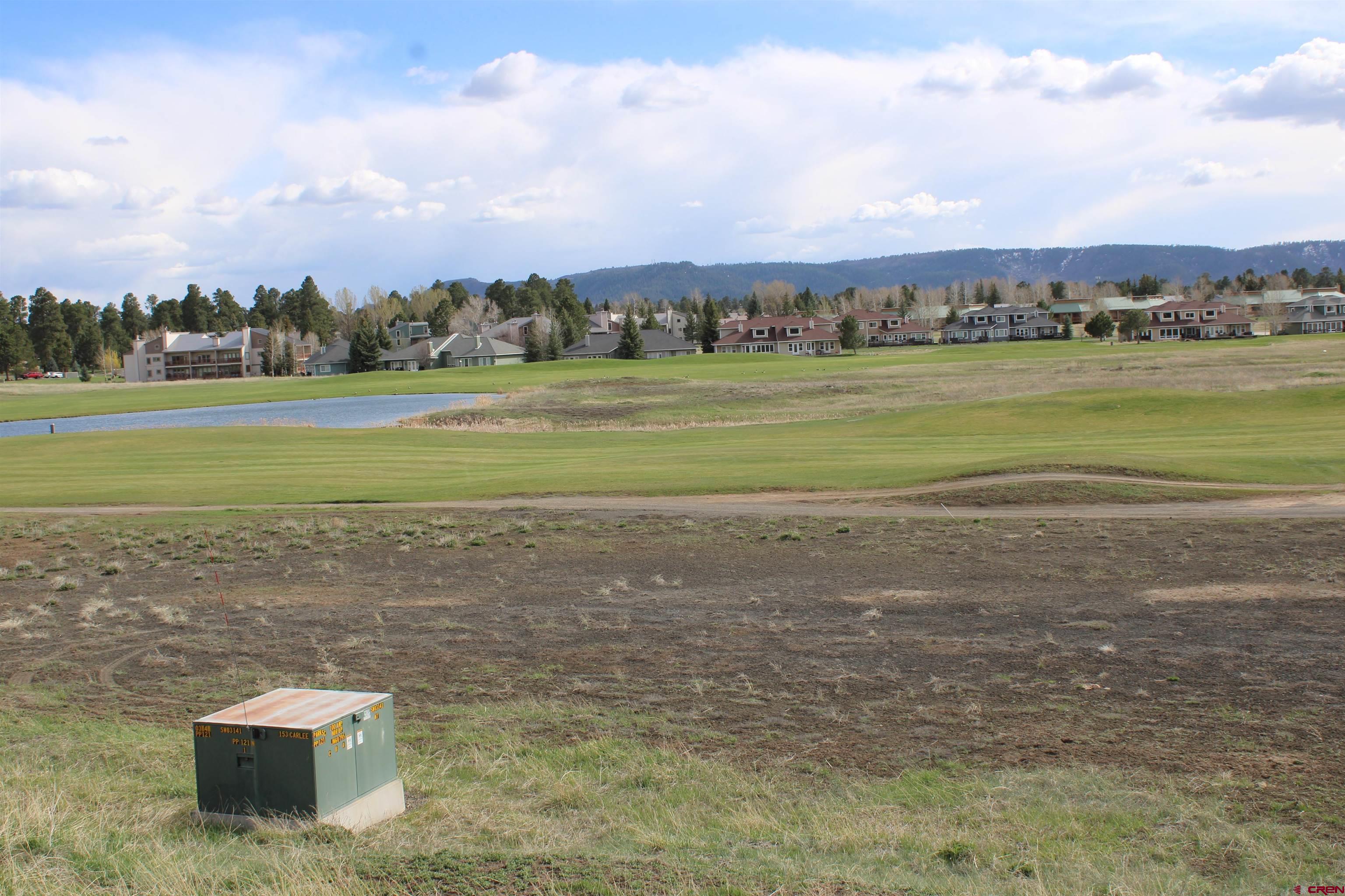 1631 Park Avenue Pagosa Springs, CO 81147 - Photo 8 of 26 a view of a lake with houses in the back