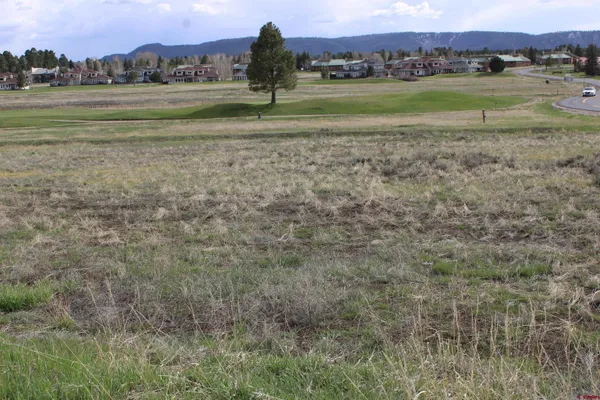 a view of an ocean and a mountain