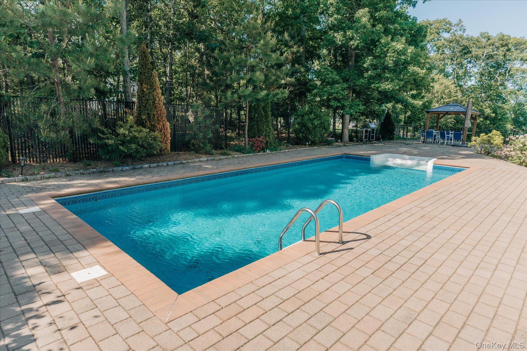 32 Red Creek Road Hampton Bays, NY 11946 - Photo 17 of 18 a view of a backyard