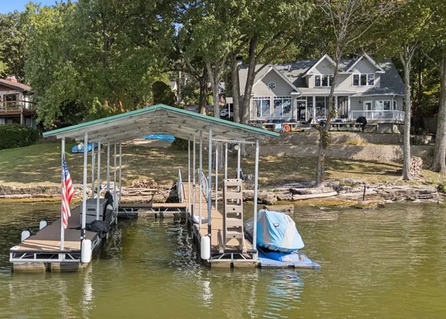a small house with swimming pool in front of it