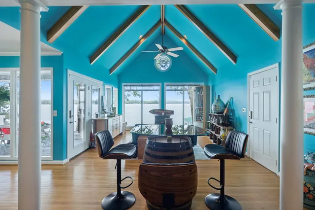 a living room with furniture and a bookshelf