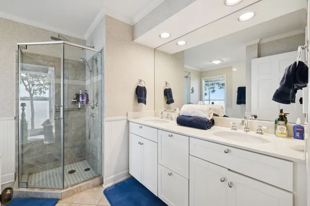 a bedroom with a bed and cabinets