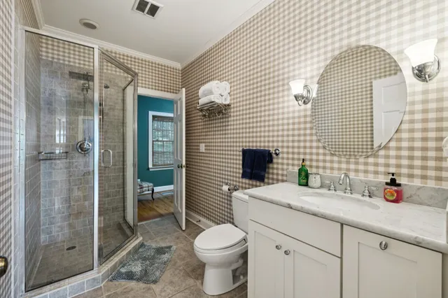 a bedroom with a bed and a television