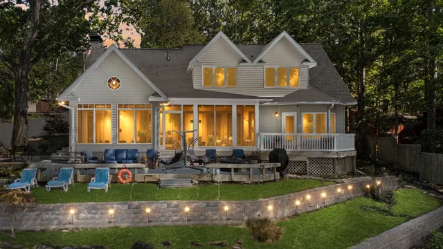 a view of a house with a tree in front