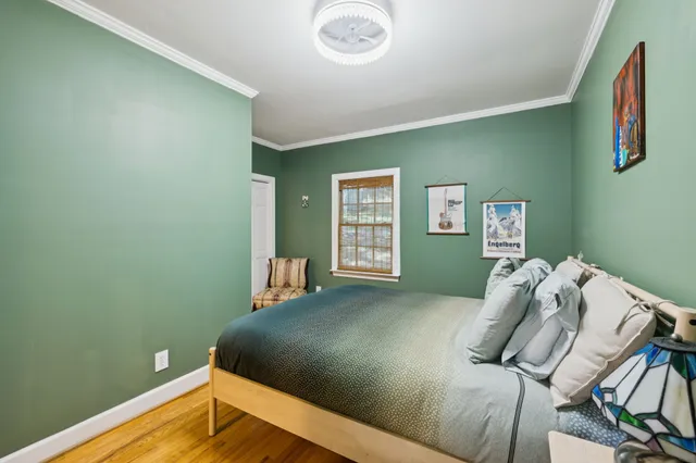 a bed room with a bed and a window