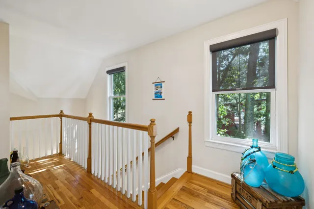 a bathroom with a tub a sink and a mirror