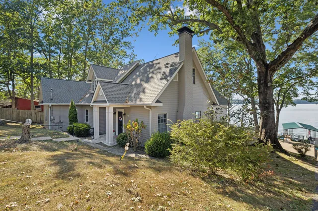 a living room with furniture fireplace and rug