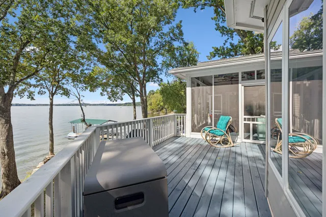 a terrace with outdoor seating and wooden floor