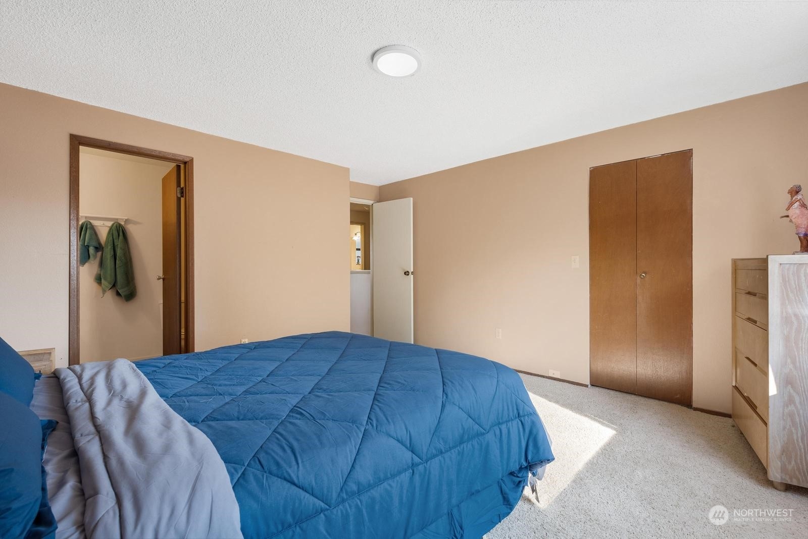2102 240th Place Southeast Bothell, WA 98021 - Photo 12 of 20 a bedroom with a bed and closet