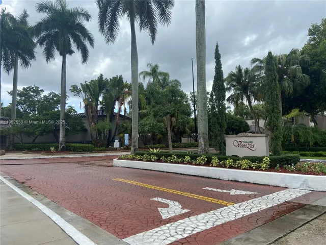 a swimming pool with outdoor seating and yard
