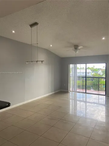 a view of an empty room with a sliding door