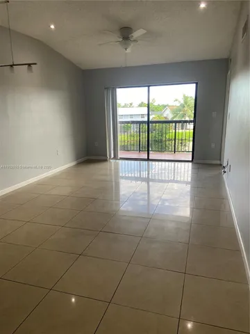 a view of an empty room with a sliding door