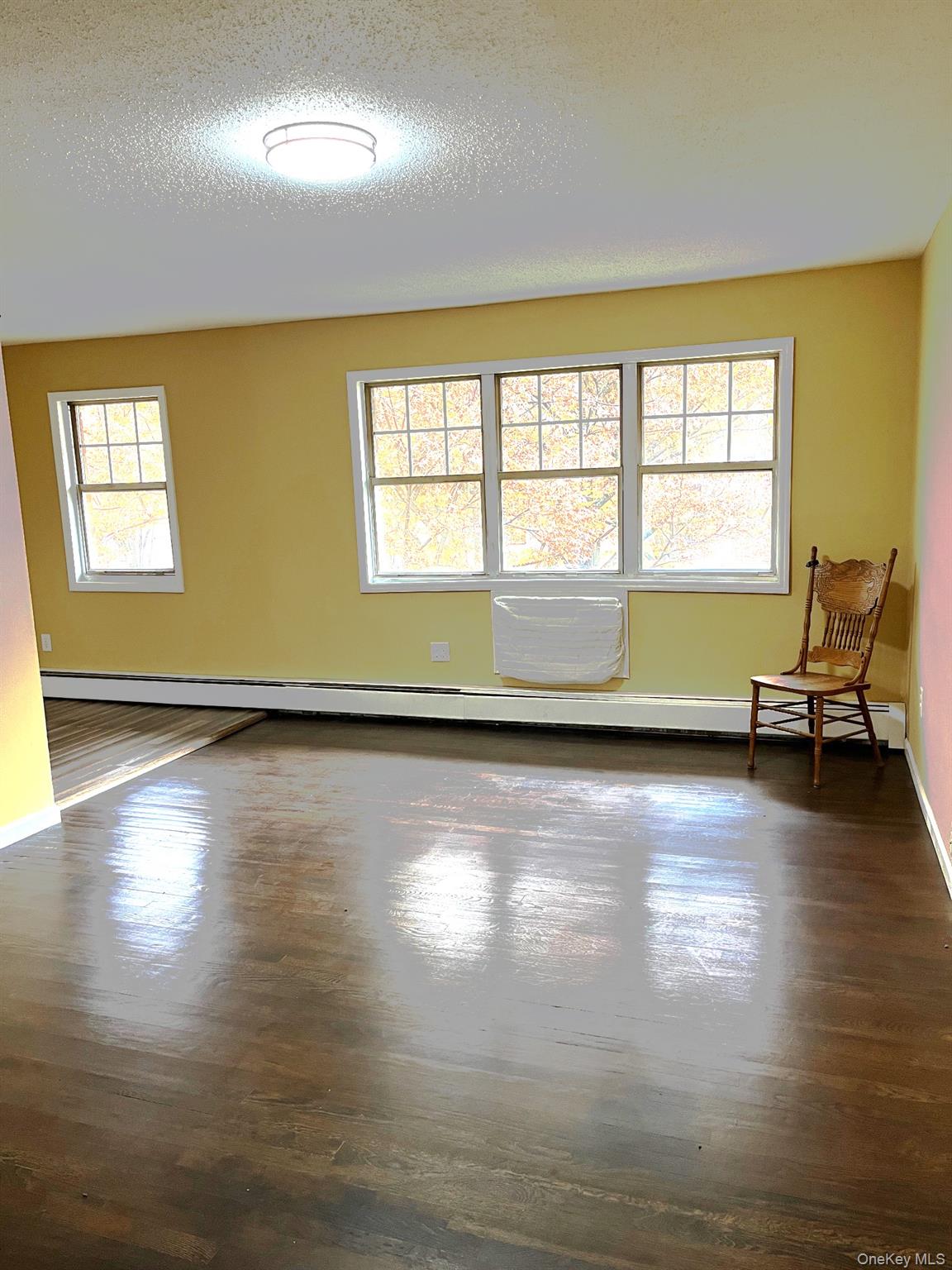 1403 Barclay Manor, Unit 14C Newburgh, NY 12550 - Photo 1 of 15 Welcome to 1403 Barclay Manor. The living room is large and has beautiful sunlight and hardwood floors. It adjoins the eat-in kitchen.