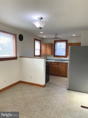 a kitchen with a cabinets and window