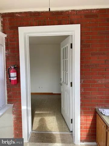 a view of a brick house with a door