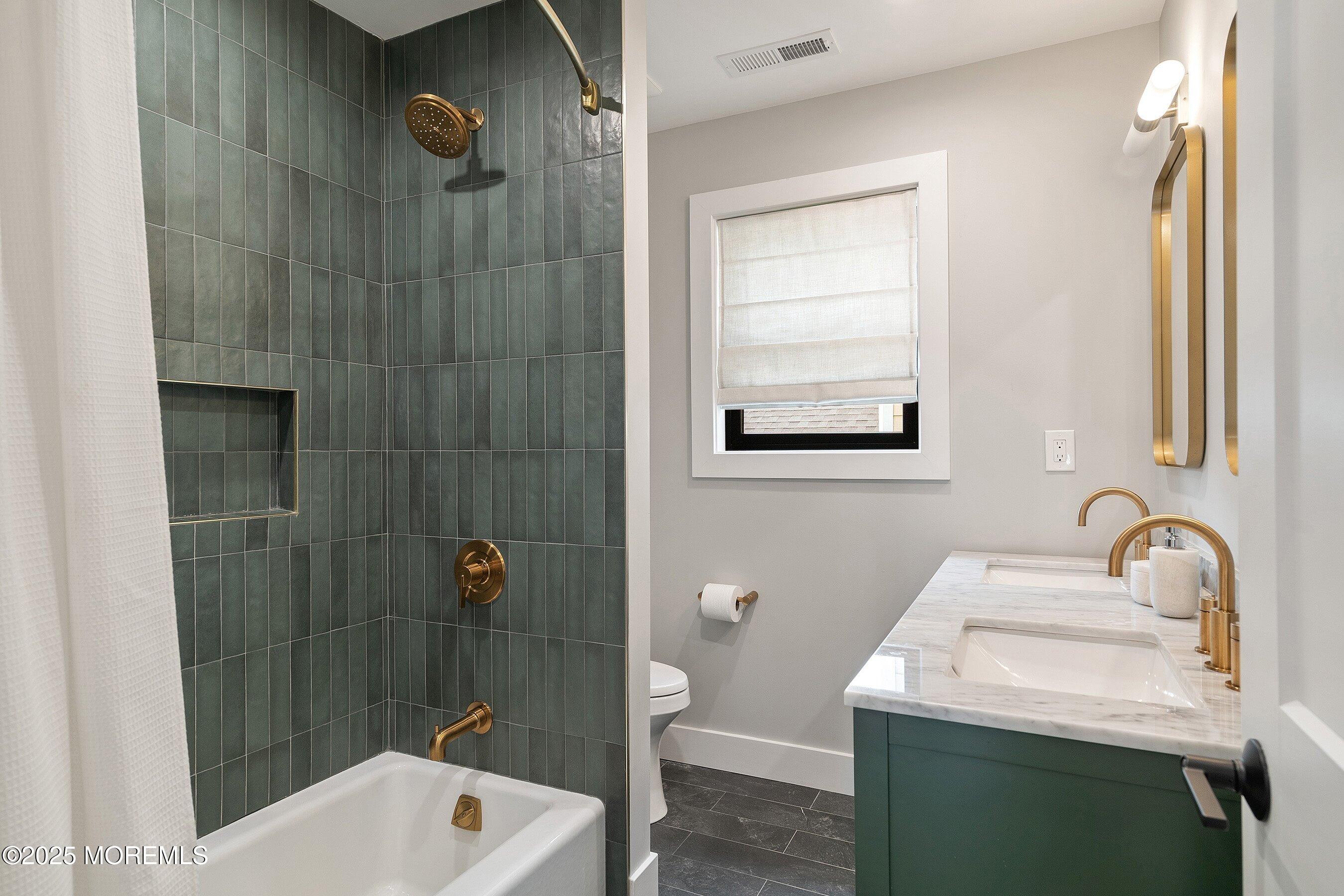 405 Ludlow Avenue Spring Lake, NJ 07762 - Photo 28 of 42 a bathroom with a sink toilet and shower