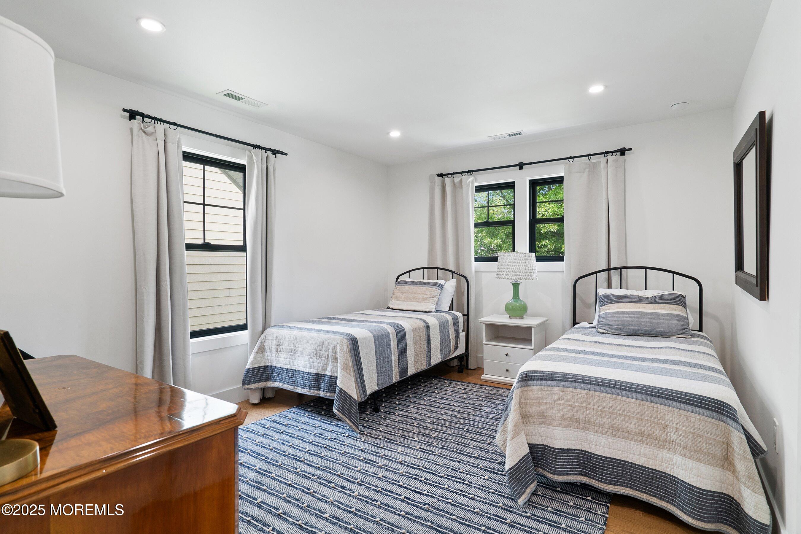 405 Ludlow Avenue Spring Lake, NJ 07762 - Photo 29 of 42 a bedroom with two beds and a window