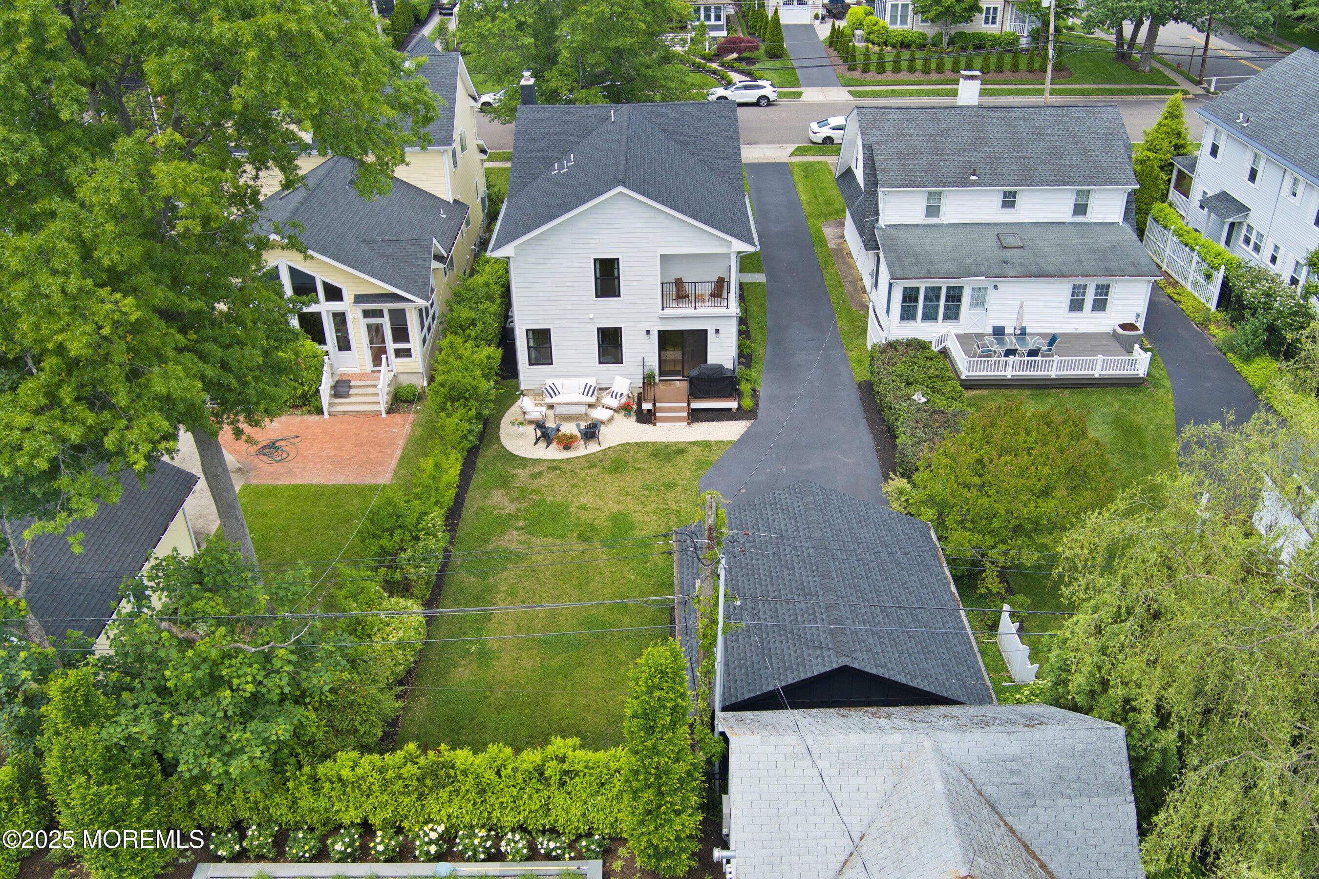 405 Ludlow Avenue Spring Lake, NJ 07762 - Photo 41 of 42 an aerial view of a house with yard and green space