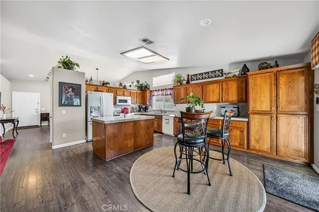 a kitchen with a stove and a refrigerator