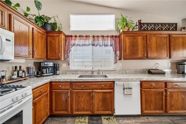 a living room with furniture a wooden floor and a chandelier