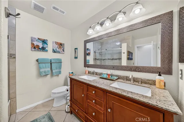 a view of a workspace with furniture and a ceiling fan