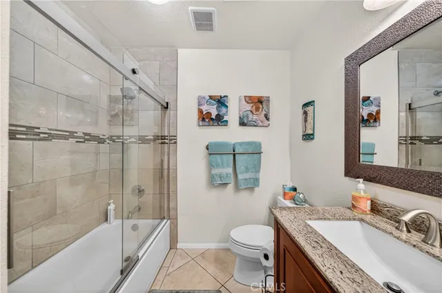 a bed room with a bed and a chandelier