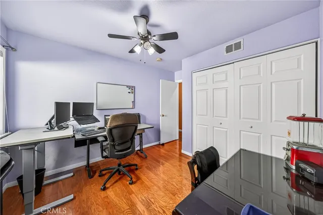 a bathroom with double vanity sinks a mirror and a shower