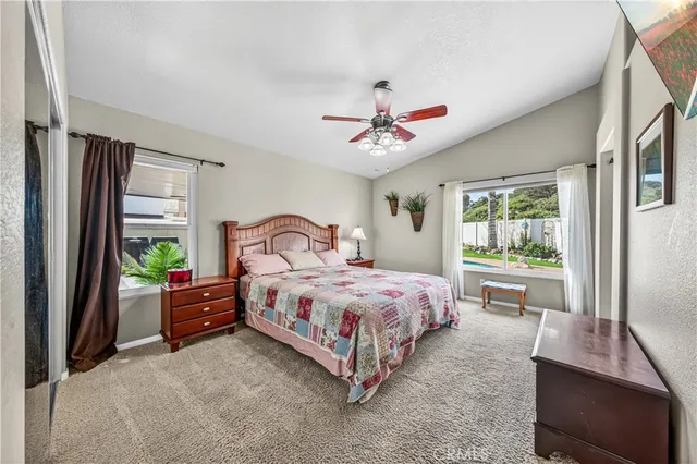 a bathroom with a granite countertop sink mirror and a bath tub