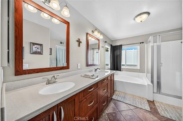 a living room with patio furniture and a wooden floor