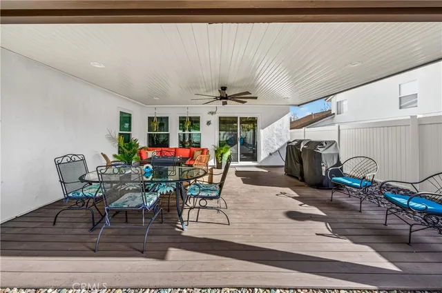 a view of a swimming pool with a patio and a yard