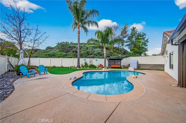 a view of a backyard with a garden and plants