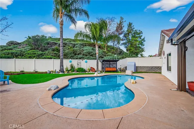 a view of a chair and table in the yard