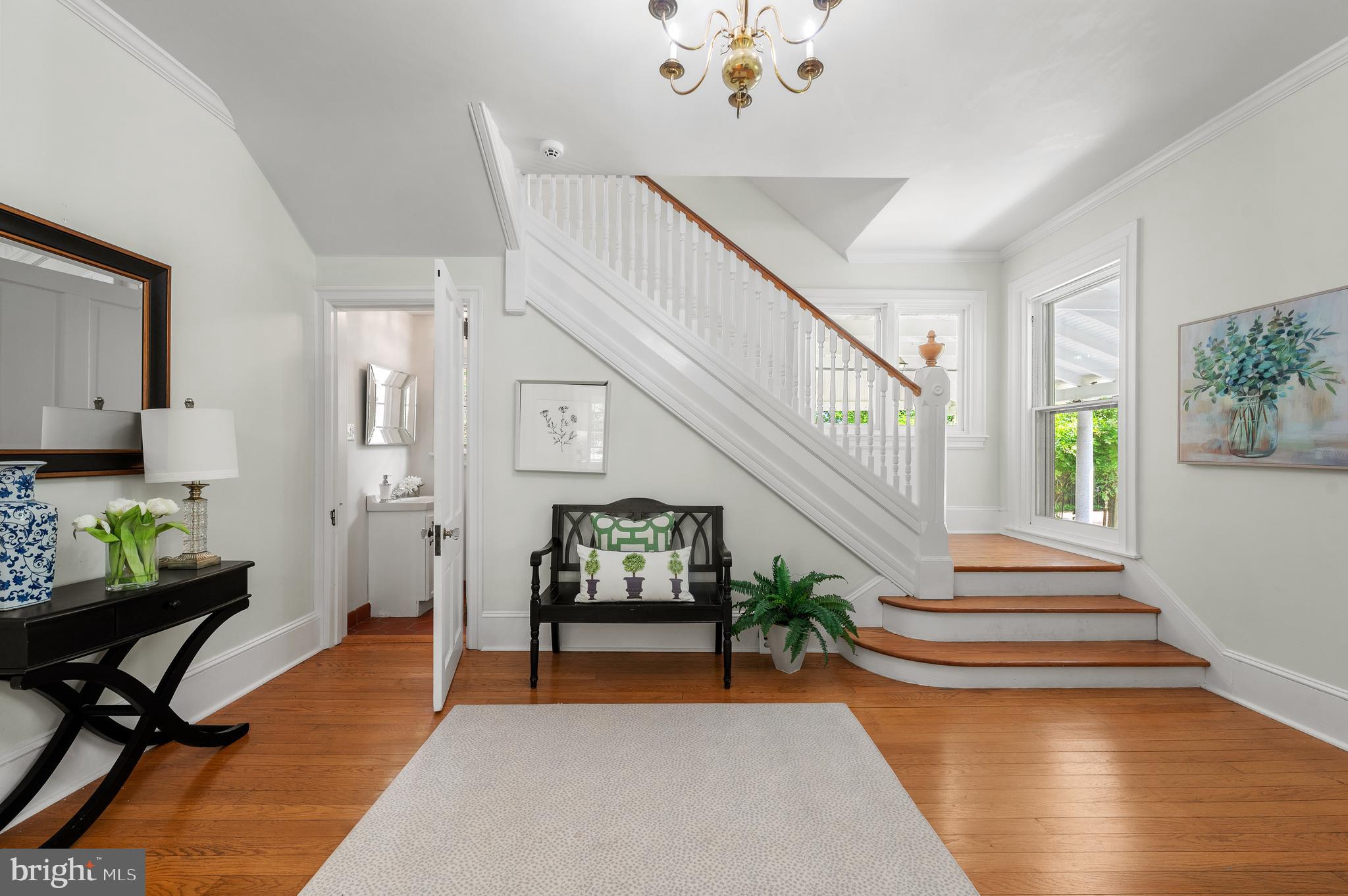 823 King Of Prussia Road Radnor, PA 19087 - Photo 12 of 71 a living room with wooden floor furniture and a potted plant