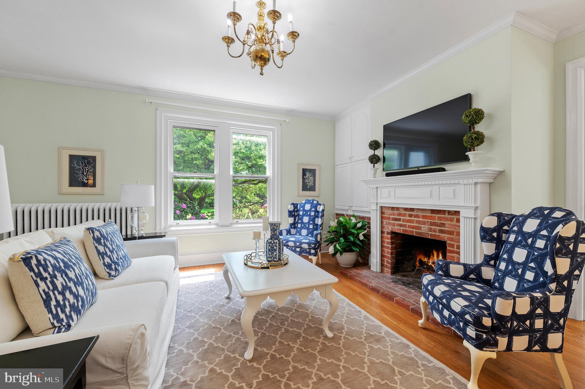 823 King Of Prussia Road Radnor, PA 19087 - Photo 15 of 71 a living room with furniture a fireplace and a flat screen tv