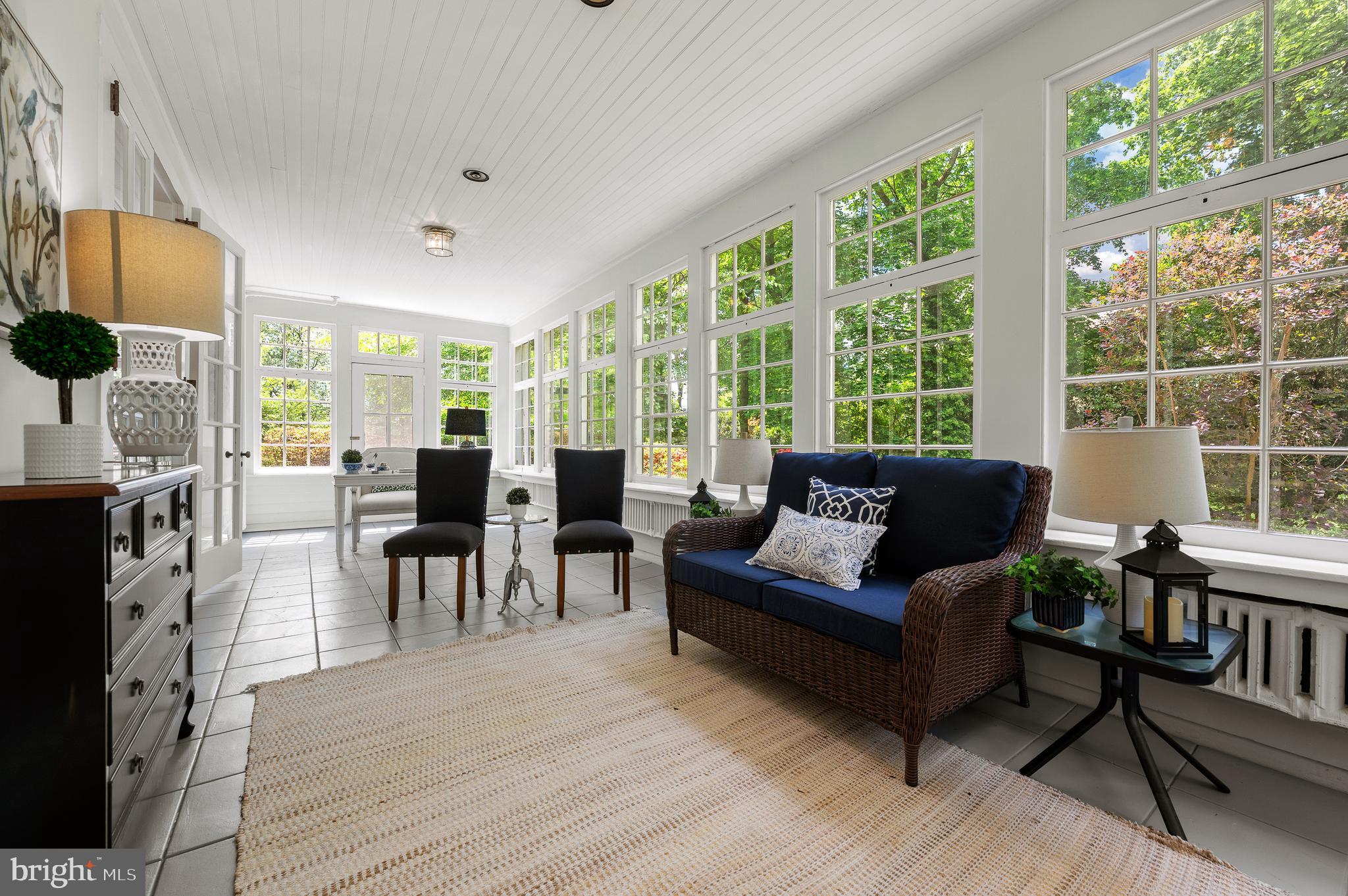 823 King Of Prussia Road Radnor, PA 19087 - Photo 29 of 71 a living room with furniture a fireplace and a floor to ceiling window