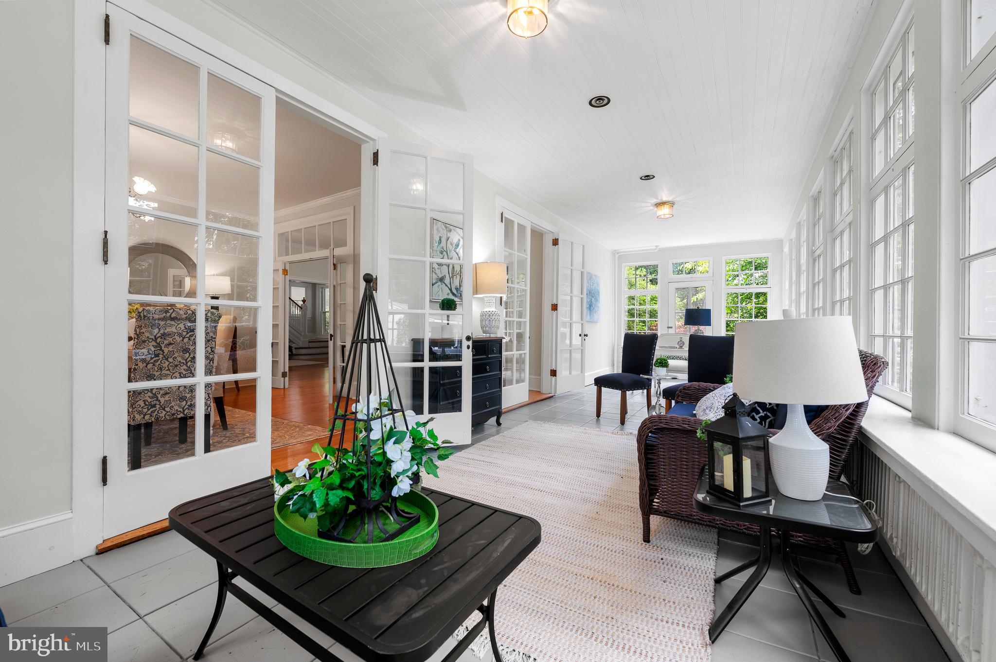 823 King Of Prussia Road Radnor, PA 19087 - Photo 30 of 71 a living room with furniture a chandelier and a large window