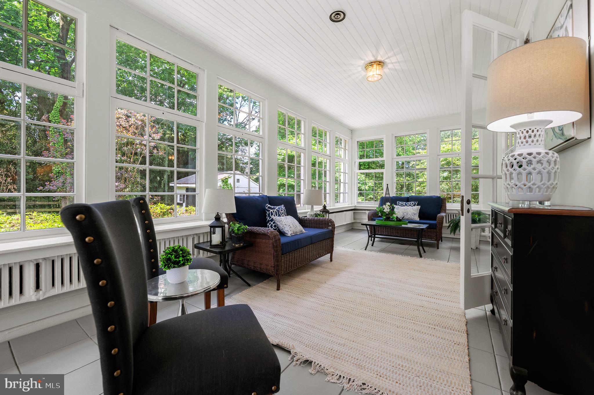 823 King Of Prussia Road Radnor, PA 19087 - Photo 33 of 71 a living room with furniture and a floor to ceiling window