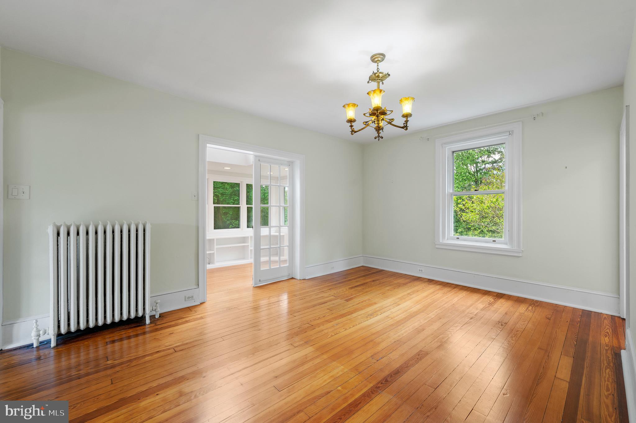 823 King Of Prussia Road Radnor, PA 19087 - Photo 38 of 71 a view of an empty room with wooden floor and a window