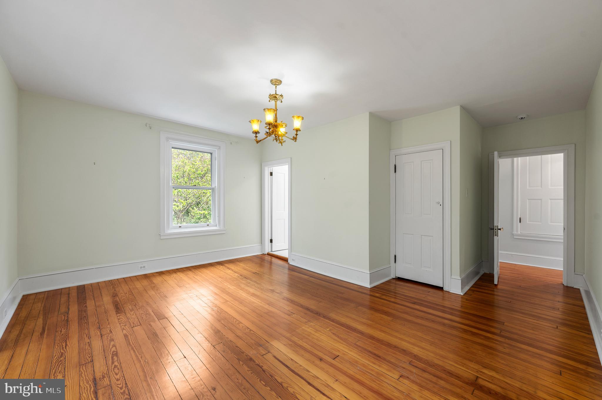 823 King Of Prussia Road Radnor, PA 19087 - Photo 39 of 71 an empty room with wooden floor and window