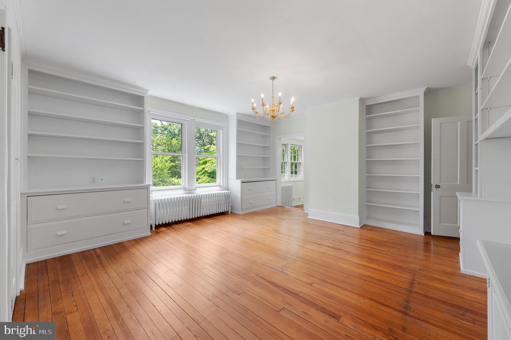 823 King Of Prussia Road Radnor, PA 19087 - Photo 46 of 71 a view of an empty room with a window and wooden floor