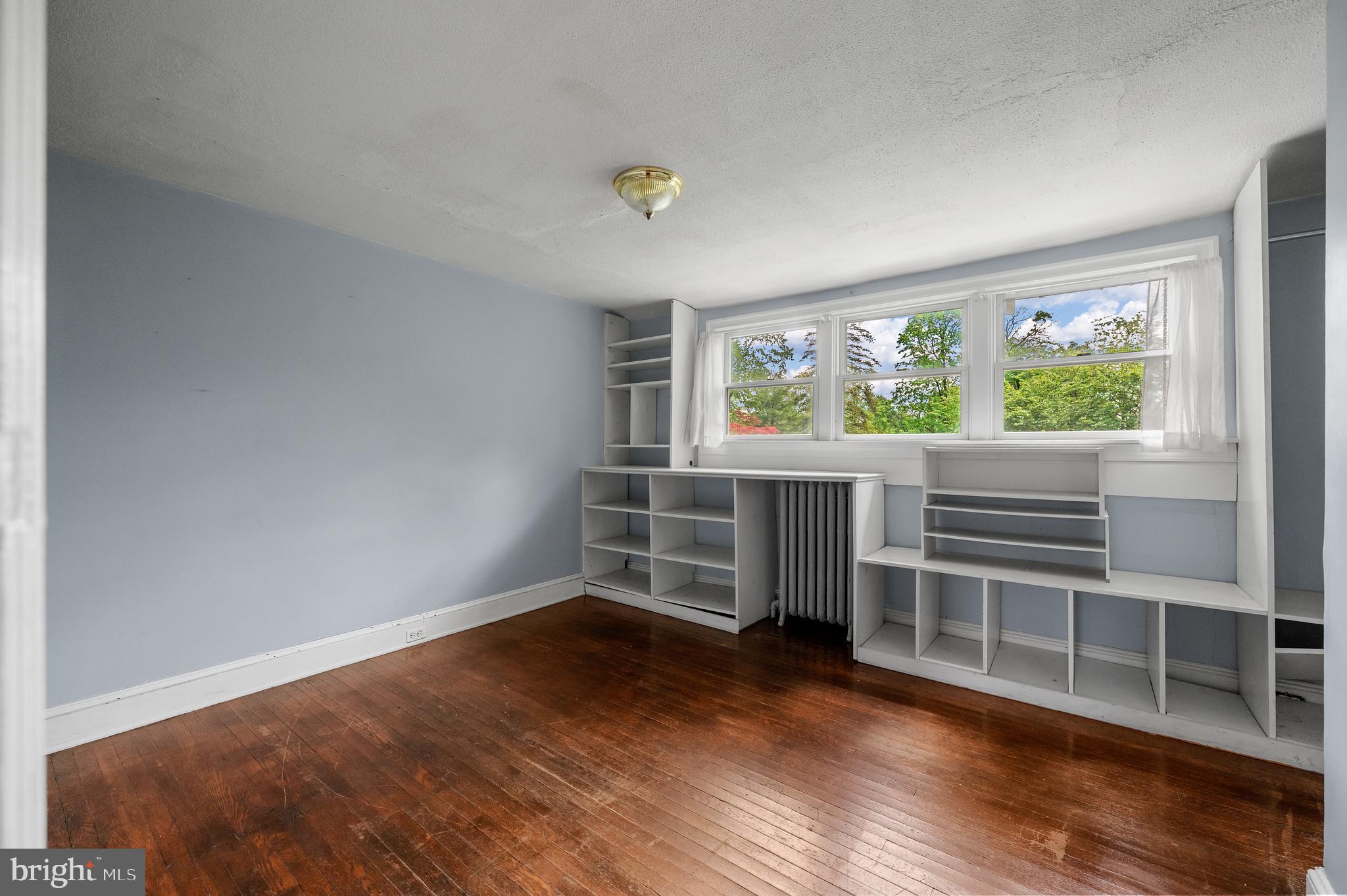 823 King Of Prussia Road Radnor, PA 19087 - Photo 55 of 71 an empty room with wooden floor and windows