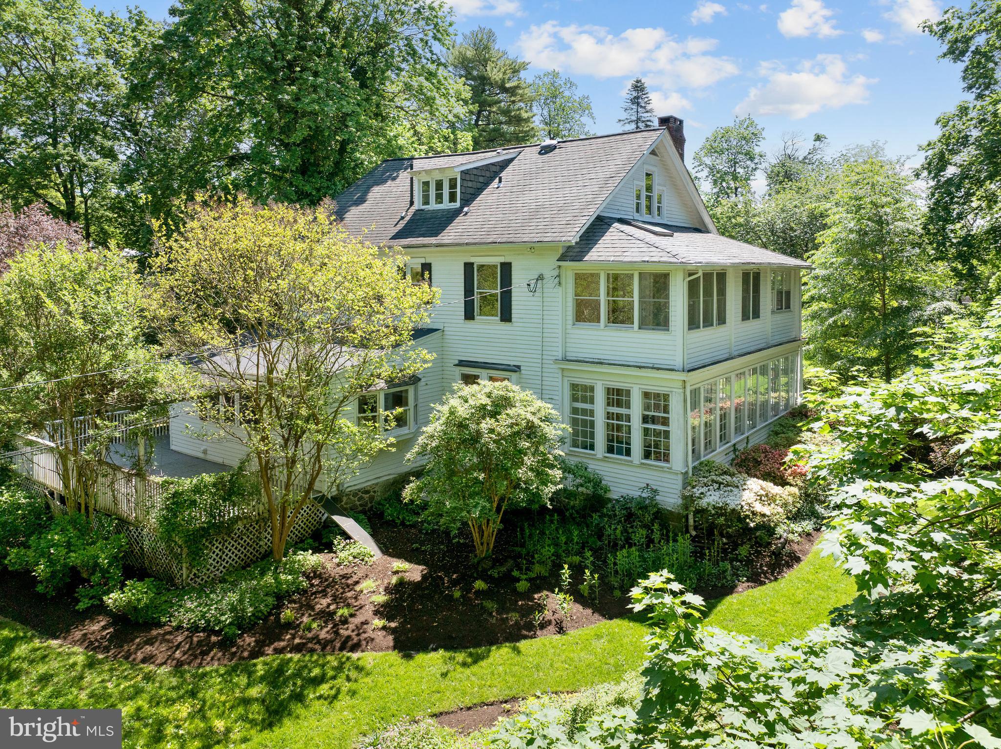 823 King Of Prussia Road Radnor, PA 19087 - Photo 9 of 71 a view of a white house with a yard and garden